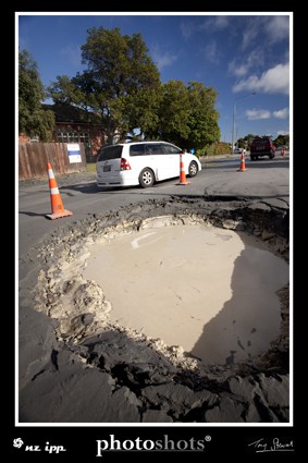 Hole in road from liquefaction eruption, Lyttelton St, Spreydon.
