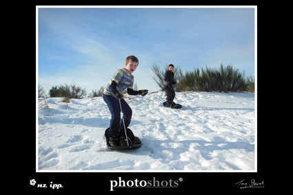 Kids having fun in the snow, Port Hills.