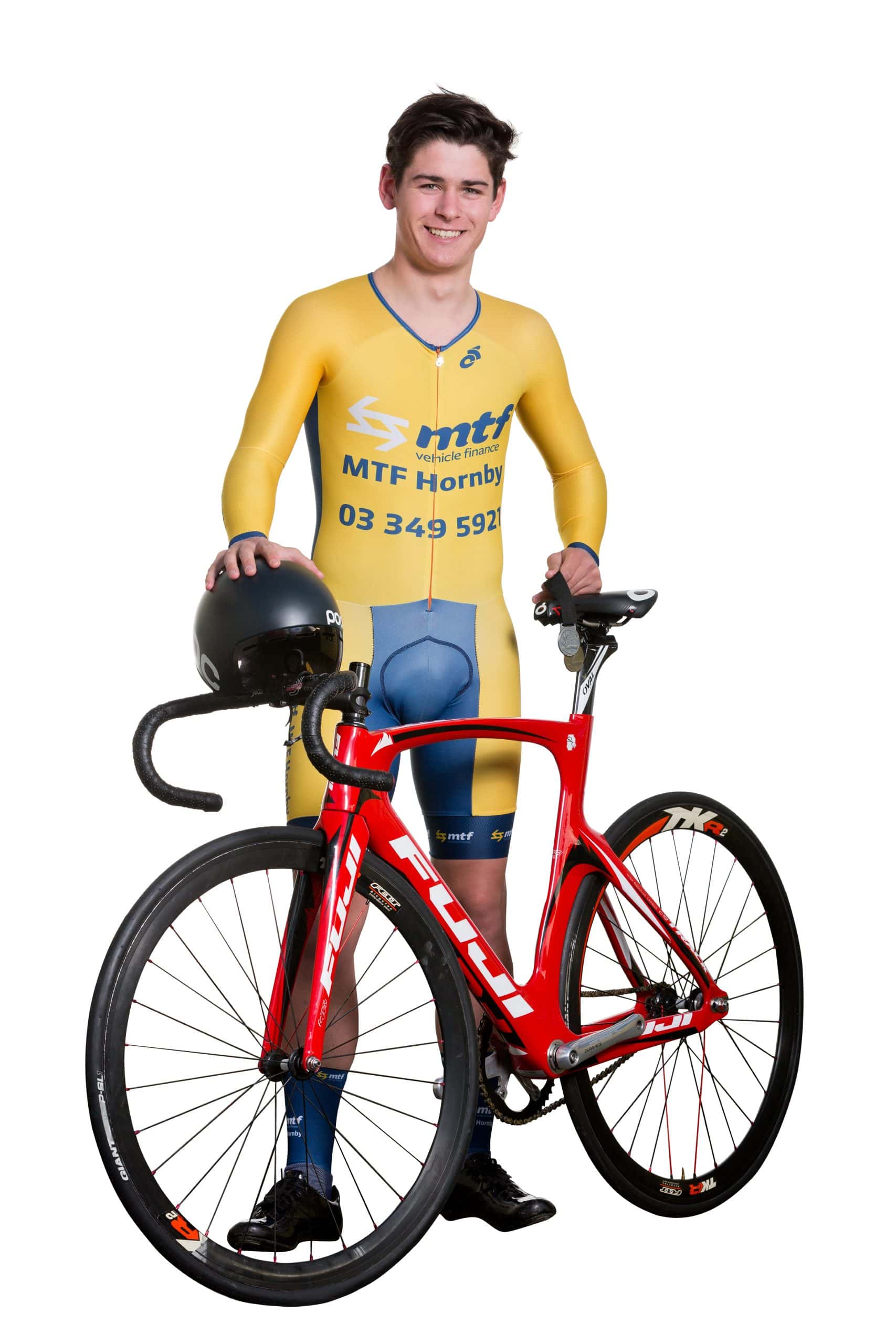 Teen male poses with racing bicycle, with a clear cut white bacground.