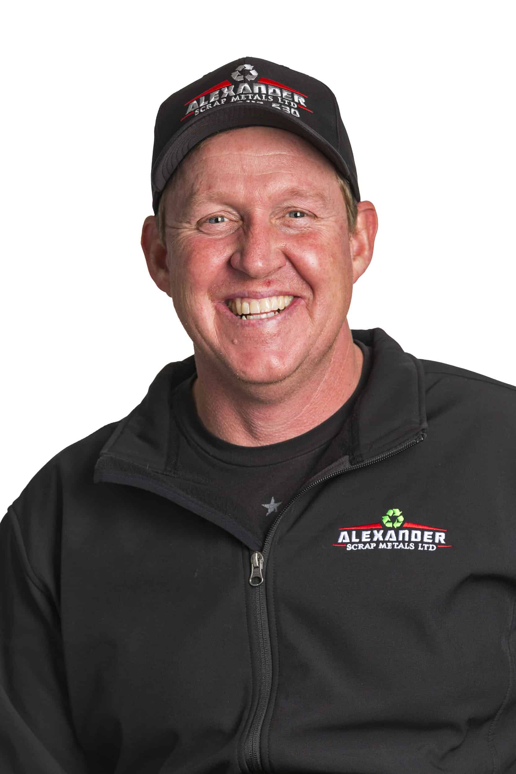 Commercial headshot, studio style, on white, of man smiling.