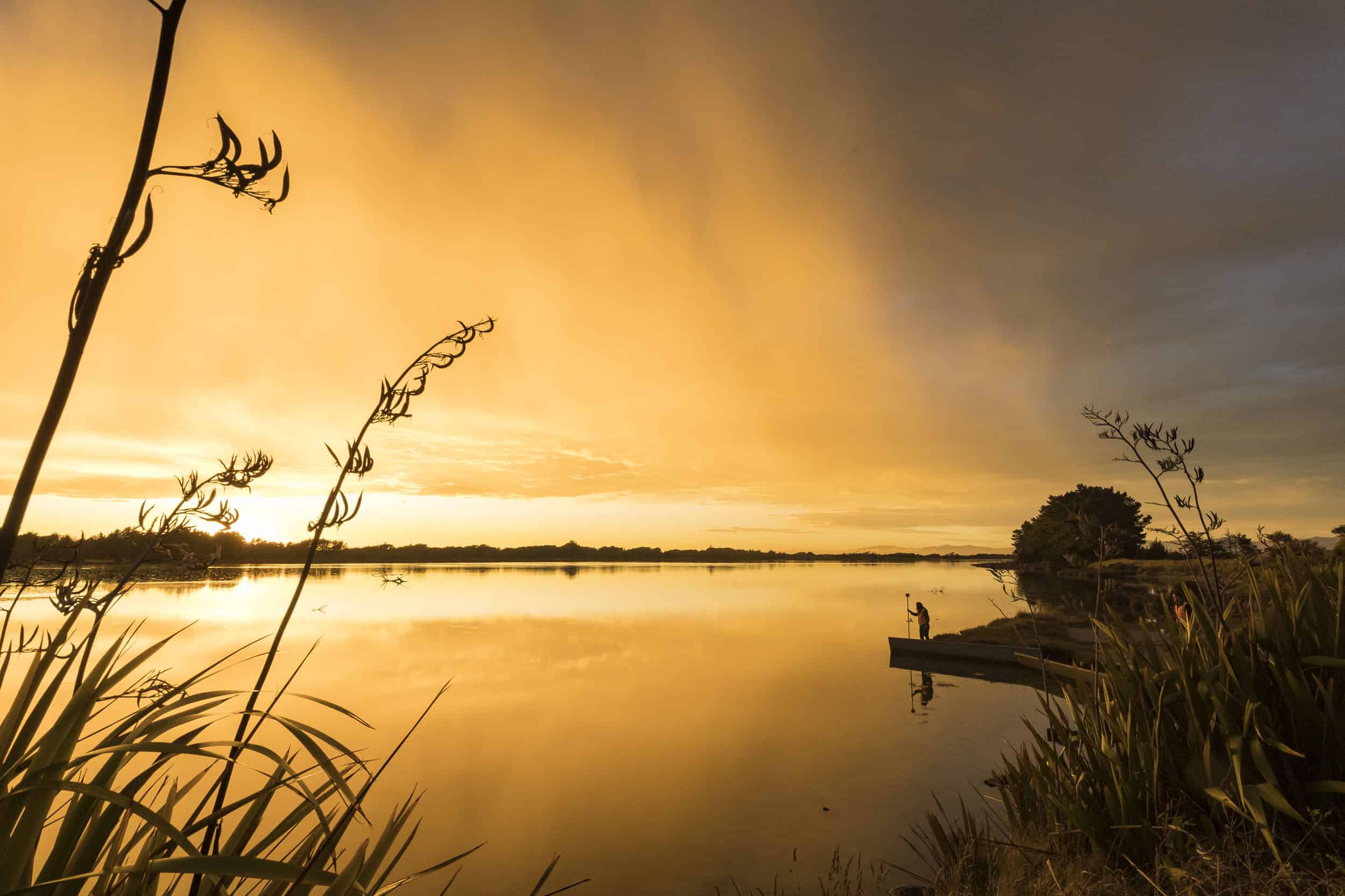 Brooklands estuary at dawn with GIS surveying equipment.