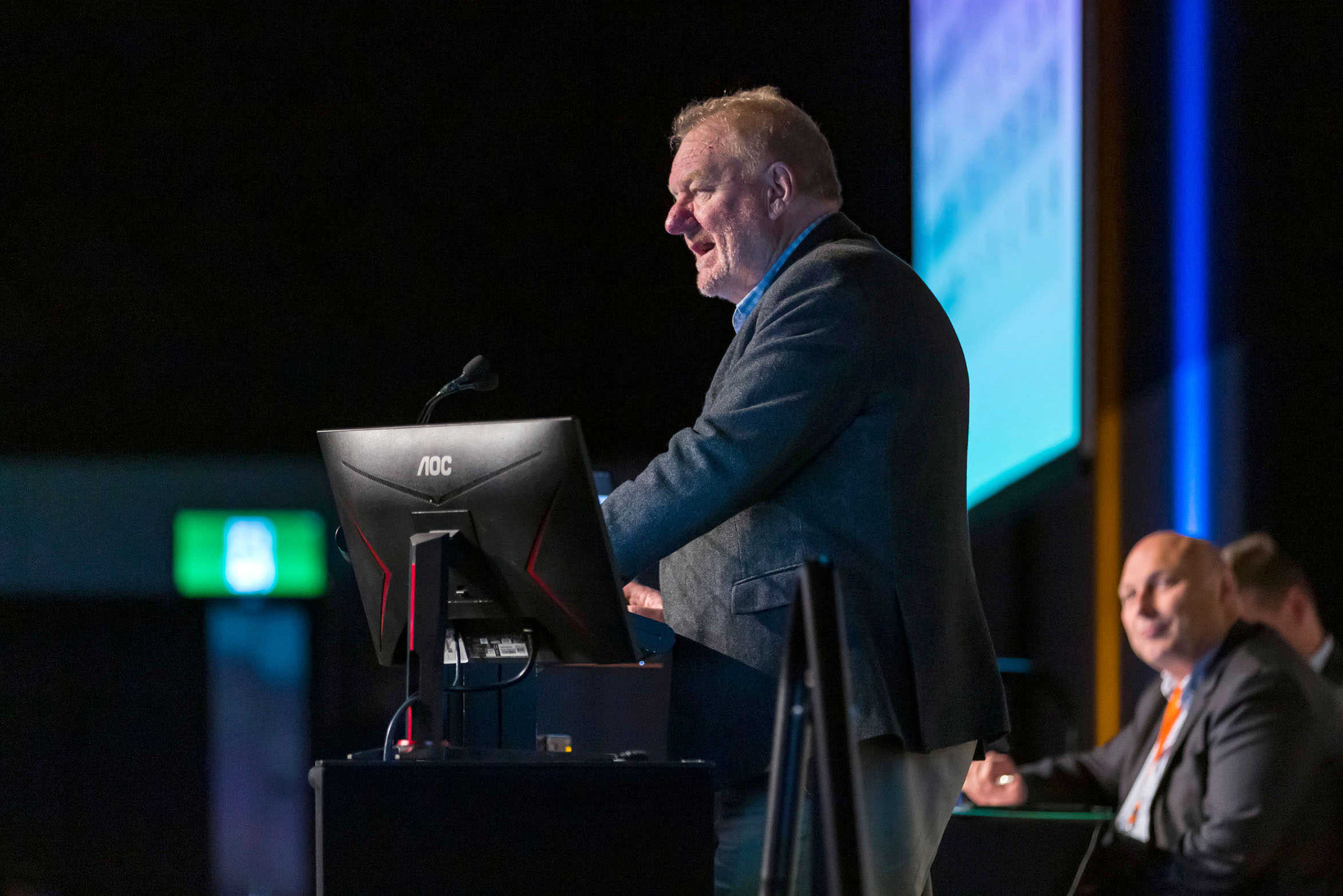 Keynote speaker during conference presentation on stage, Te Pae, Christchurch.