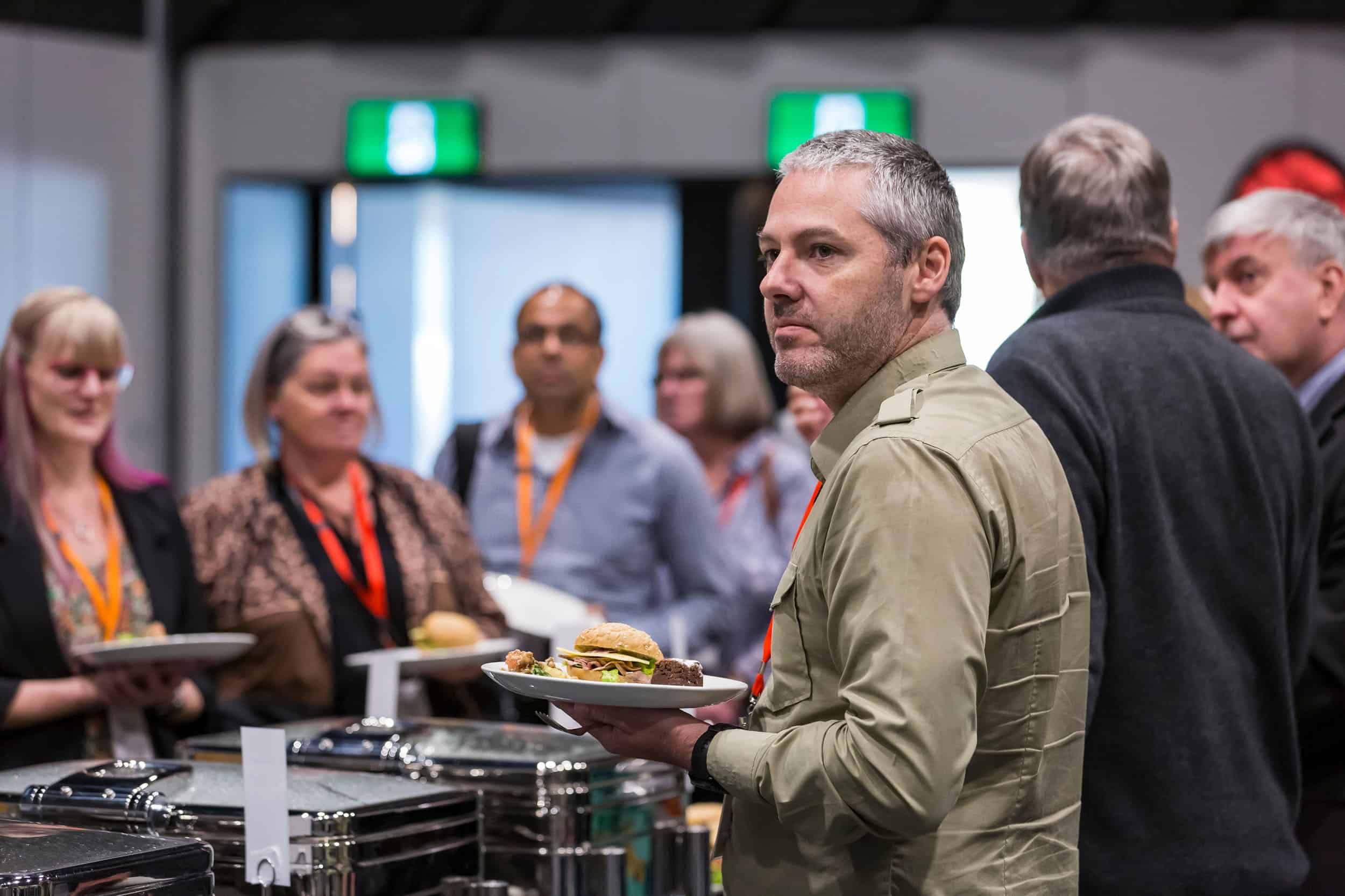 Attendees line up for lunch during a conference Te Pae, CHCH.