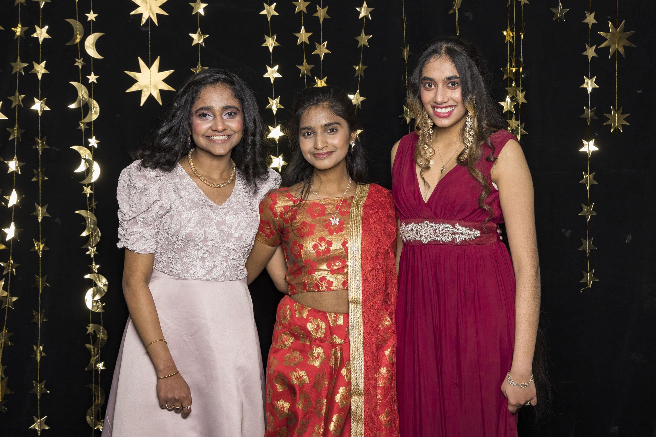Indian students at their high school formal dressed in special outfits.