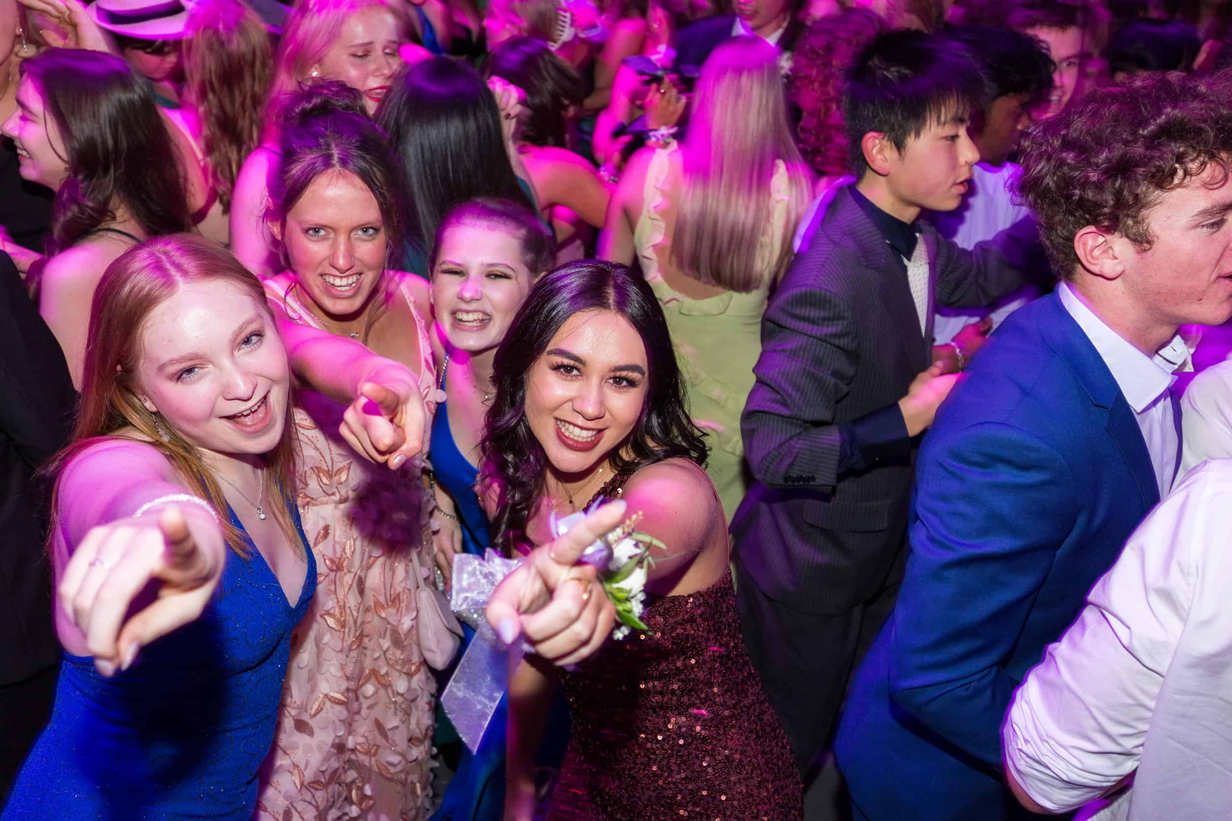 Slow sync flash used to capture students having fun on the dance floor at their school formal.