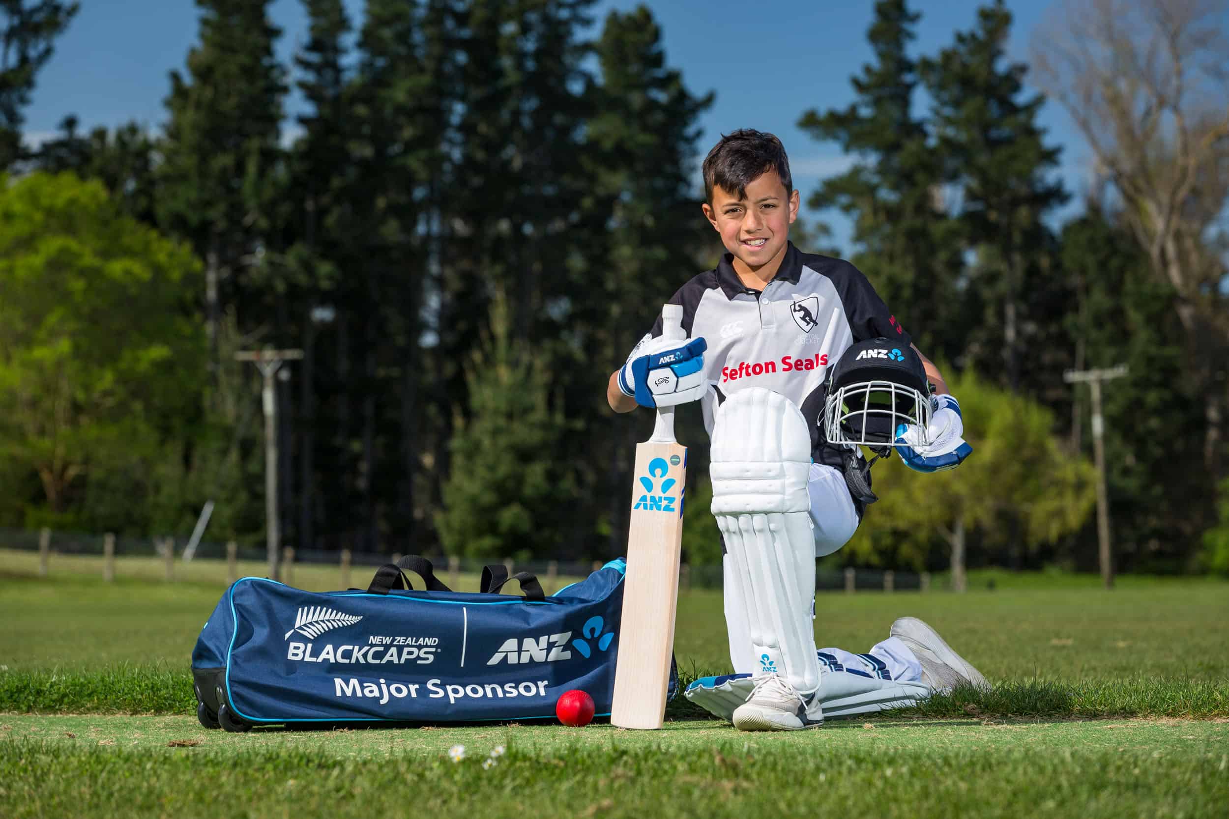 Young cricket player with ANZ sponsored sports equipment, Sefton.
