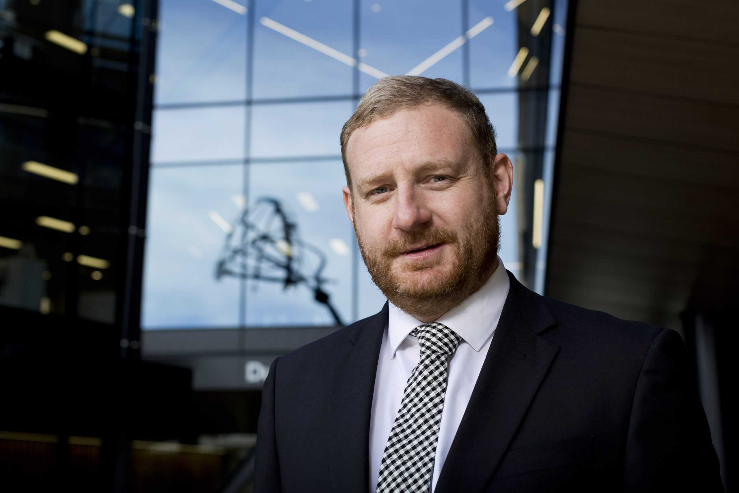 Lawyer poses outside chambers, CHCH CBD.