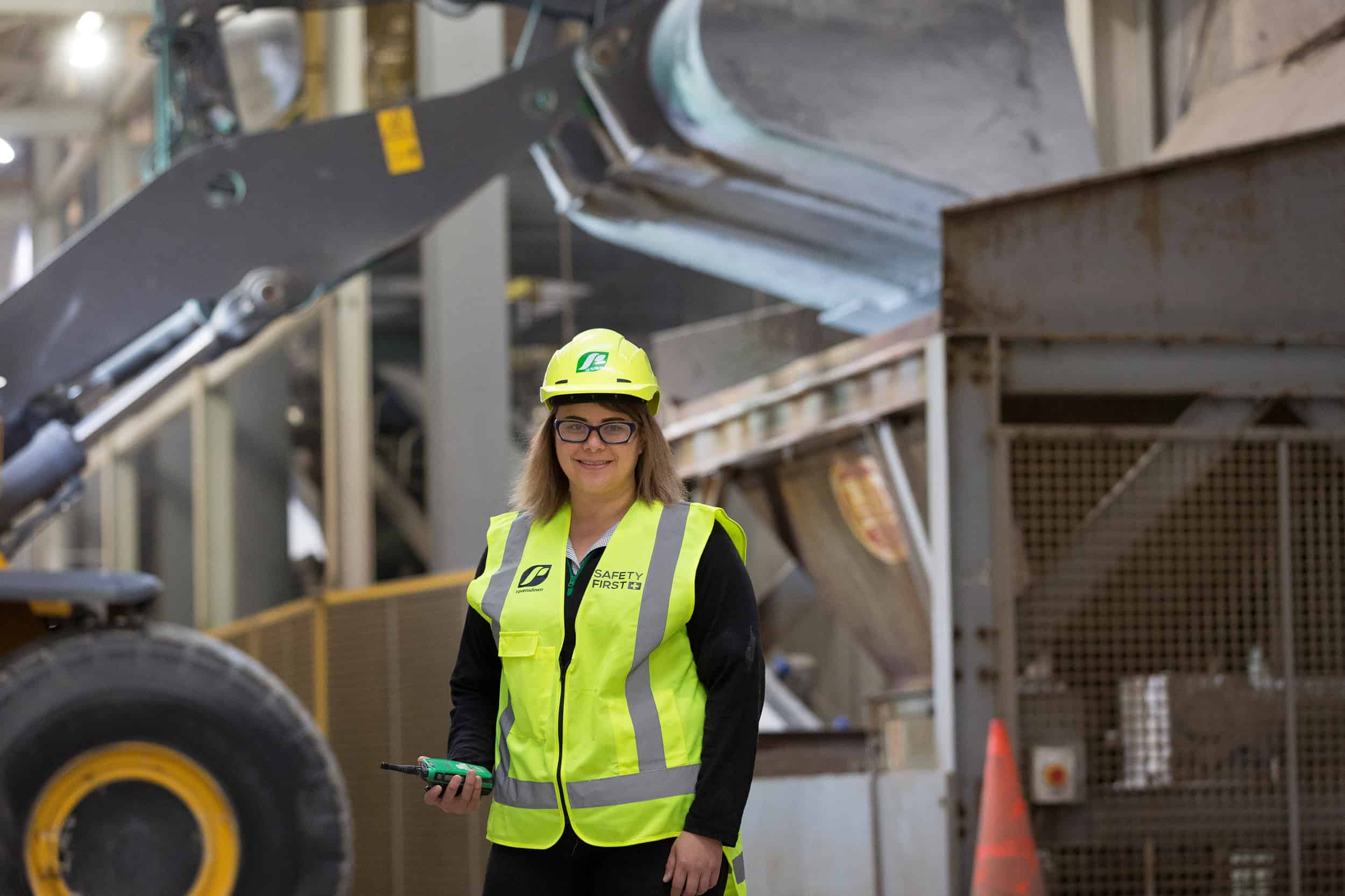 Fertilizer rep wears PPE in warehouse.