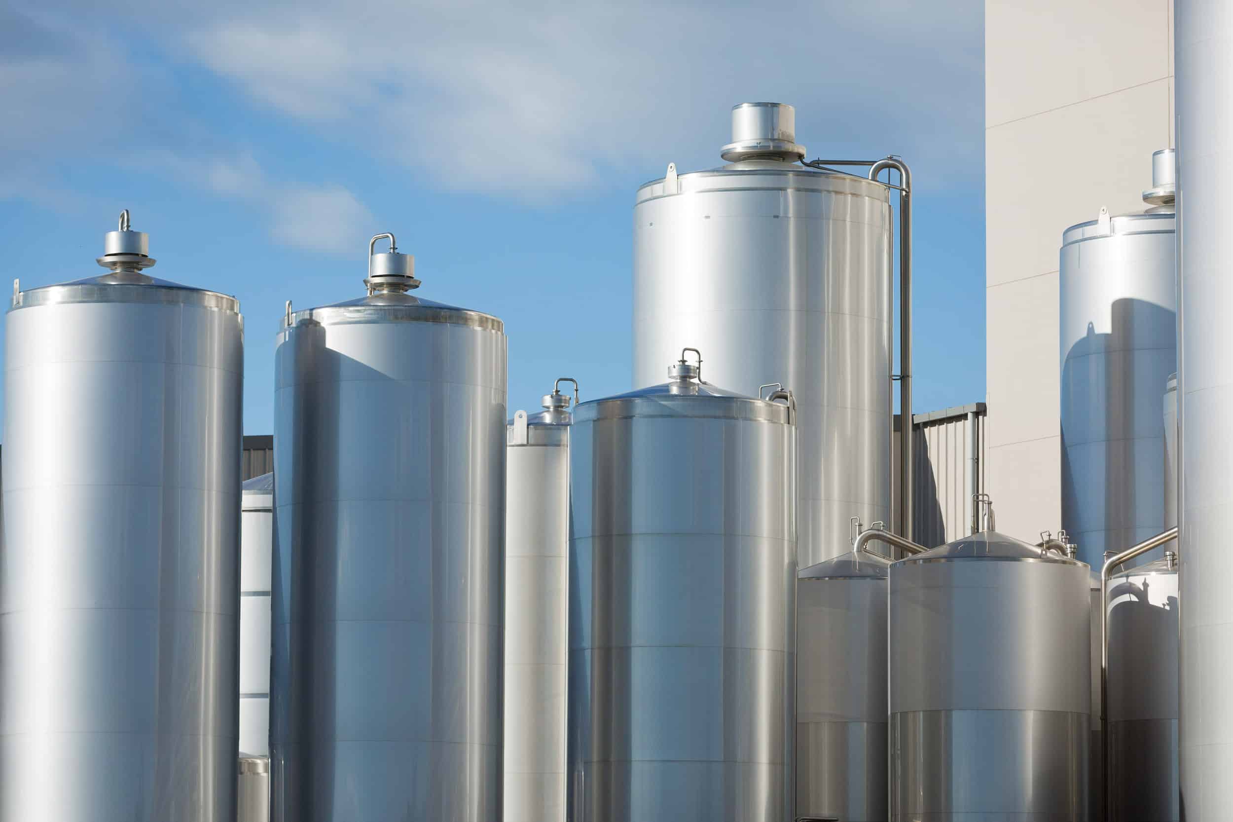 Stainless steel milk vats at processing factory, Canterbury.