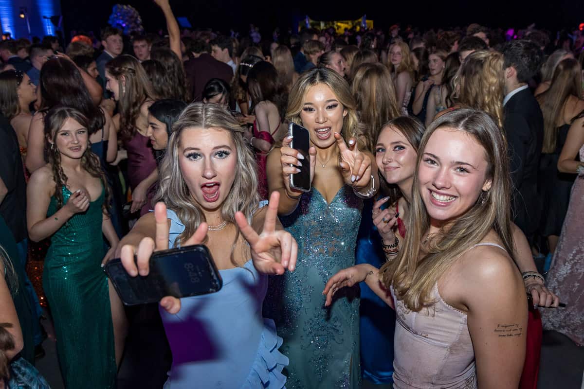 Girls dancing at school ball / formal