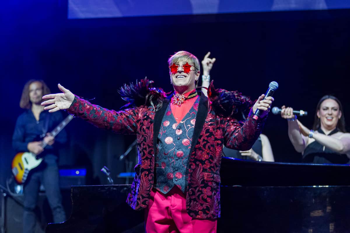Elton John tribute act performer welcomes crowd on stage at Te Pae Christchurch.