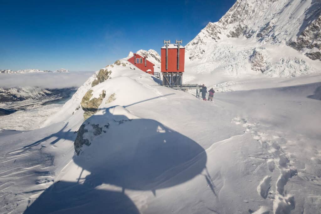 Chopper shadow landing Plateau Hut, Southern Alps